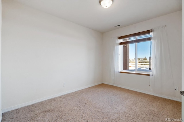 spare room featuring carpet floors