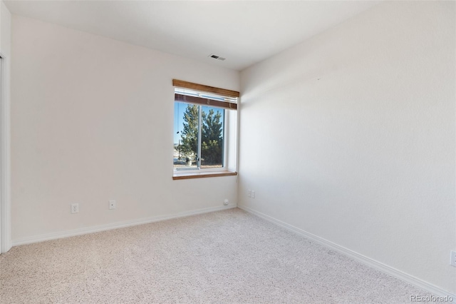 empty room with carpet flooring