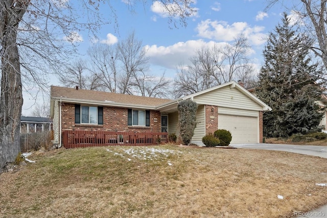 ranch-style home with a garage and a front lawn