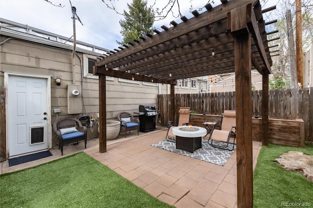 view of patio / terrace featuring an outdoor fire pit, a pergola, fence, and grilling area