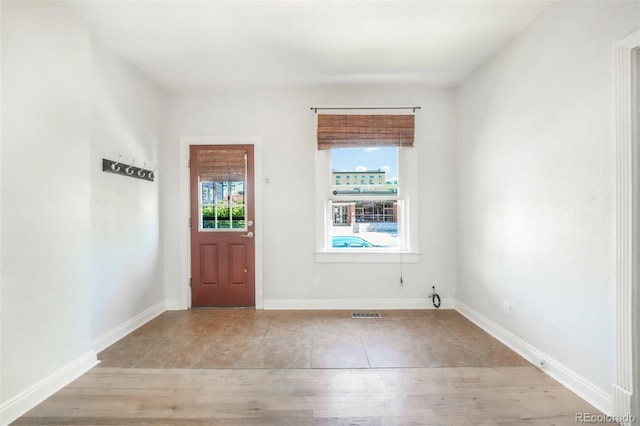 22 E Bayaud Ave, Denver, CO 80209 - foyer entrance featuring light tile patterned floors and baseboards