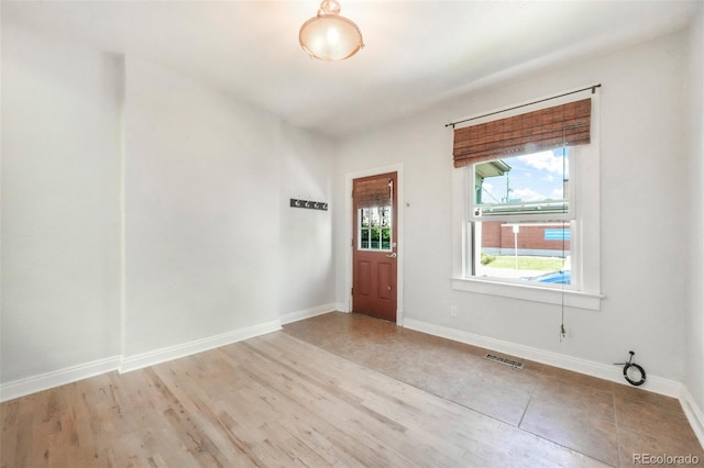 22 E Bayaud Ave, Denver, CO 80209 - entryway with baseboards and wood finished floors