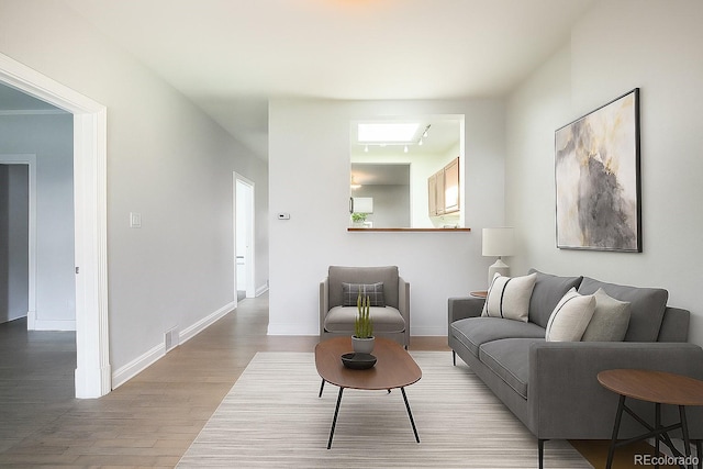 22 E Bayaud Ave, Denver, CO 80209 - living area with wood finished floors and baseboards
