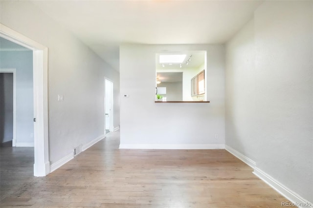 22 E Bayaud Ave, Denver, CO 80209 - unfurnished room with light wood-style floors and baseboards