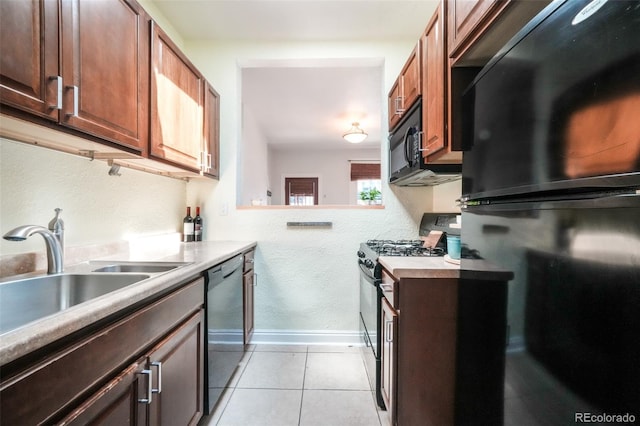 22 E Bayaud Ave, Denver, CO 80209 - kitchen featuring black appliances, light countertops, and light tile patterned flooring