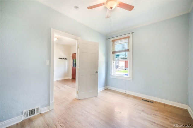 22 E Bayaud Ave, Denver, CO 80209 - spare room featuring wood finished floors and ceiling fan