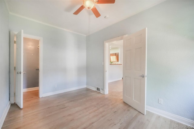 22 E Bayaud Ave, Denver, CO 80209 - empty room featuring ceiling fan, light wood-type flooring, and crown molding