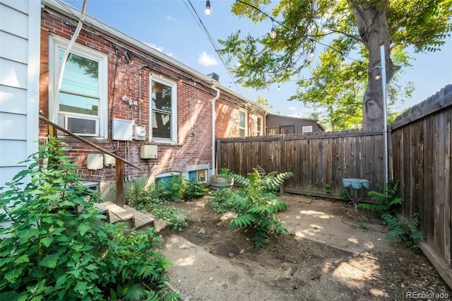 22 E Bayaud Ave, Denver, CO 80209 - view of home's exterior featuring brick siding and cooling unit