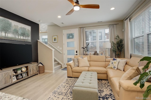 9279 Merino Ct Unit D, Littleton, CO 80125 - living room featuring wood finished floors, a ceiling fan, stairs, recessed lighting, and baseboards
