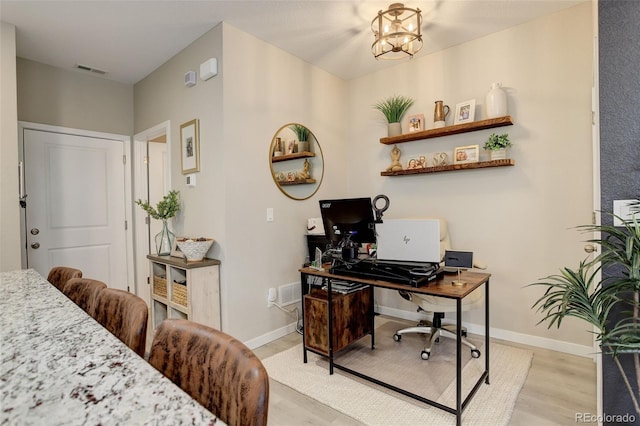 9279 Merino Ct Unit D, Littleton, CO 80125 - office with light wood-style floors, baseboards, and a chandelier