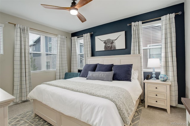 9279 Merino Ct Unit D, Littleton, CO 80125 - bedroom featuring light carpet and ceiling fan