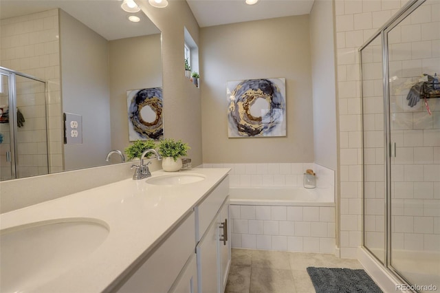 9279 Merino Ct Unit D, Littleton, CO 80125 - full bathroom with a shower stall, a garden tub, double vanity, and recessed lighting