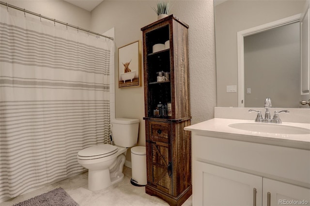 9279 Merino Ct Unit D, Littleton, CO 80125 - bathroom with toilet, vanity, curtained shower, and tile patterned floors