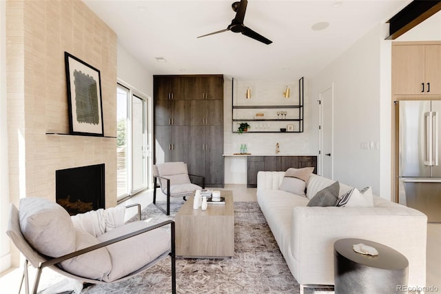 16133 W 14th Ave, Golden, CO 80401 - living room featuring a brick fireplace and ceiling fan