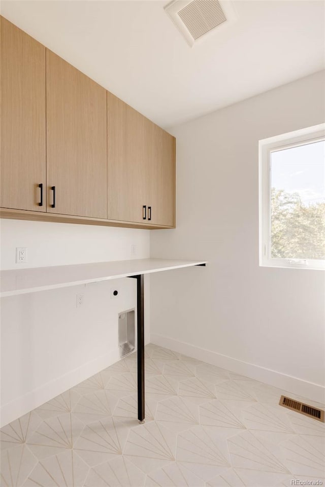 16133 W 14th Ave, Golden, CO 80401 - clothes washing area featuring cabinets and hookup for an electric dryer