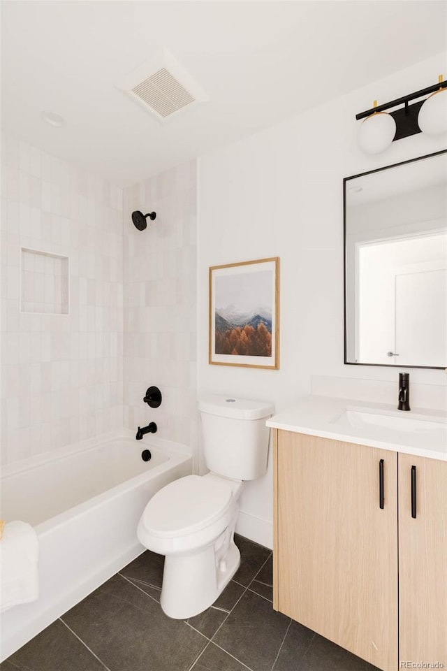 16133 W 14th Ave, Golden, CO 80401 - full bathroom featuring vanity, tiled shower / bath, tile patterned floors, and toilet