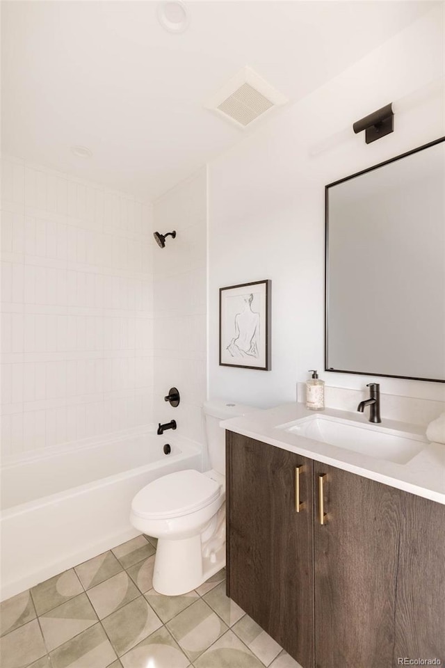 16133 W 14th Ave, Golden, CO 80401 - full bathroom with tile patterned floors, toilet, tiled shower / bath combo, and vanity