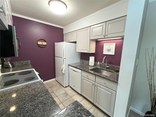4676 White Rock Cir Unit 12, Boulder, CO 80301 - kitchen featuring white appliances, ornamental molding, light tile patterned floors, white cabinets, and dark stone counters