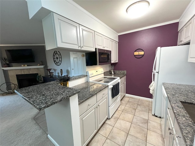 4676 White Rock Cir Unit 12, Boulder, CO 80301 - kitchen with white appliances, ornamental molding, a peninsula, dark stone counters, and white cabinetry