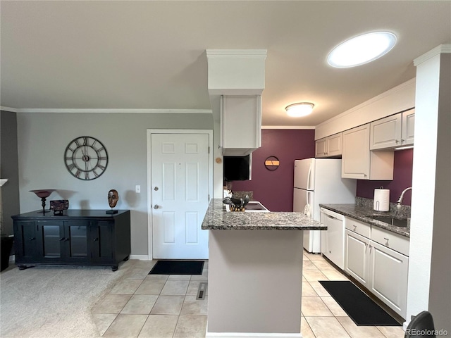 4676 White Rock Cir Unit 12, Boulder, CO 80301 - kitchen featuring white appliances, ornamental molding, light tile patterned flooring, a peninsula, and dark stone counters