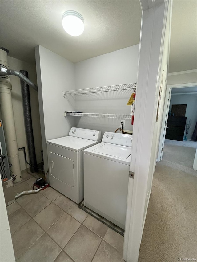 4676 White Rock Cir Unit 12, Boulder, CO 80301 - laundry room featuring washer and dryer and light tile patterned floors