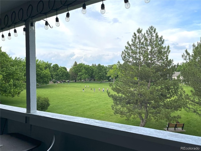 4676 White Rock Cir Unit 12, Boulder, CO 80301 - view of yard with a balcony and view of wooded area