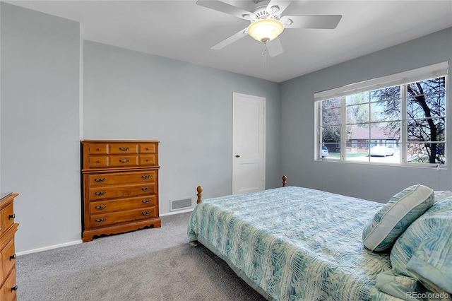 891 Ursula St, Aurora, CO 80011 - carpeted bedroom with baseboards and a ceiling fan