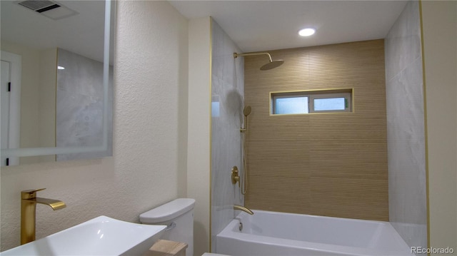 2441 W 55th Ave, Denver, CO 80221 - bathroom featuring toilet, bathing tub / shower combination, and vanity