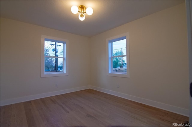 2441 W 55th Ave, Denver, CO 80221 - empty room with wood finished floors and baseboards