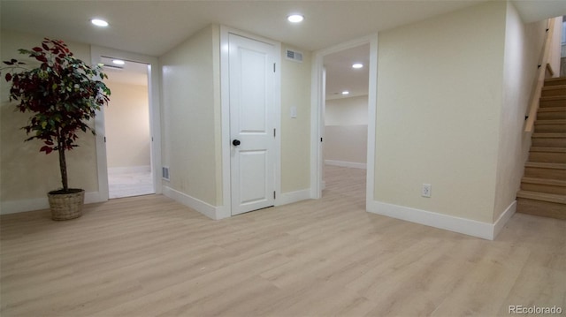 2441 W 55th Ave, Denver, CO 80221 - finished below grade area featuring wood finished floors, stairway, recessed lighting, and baseboards