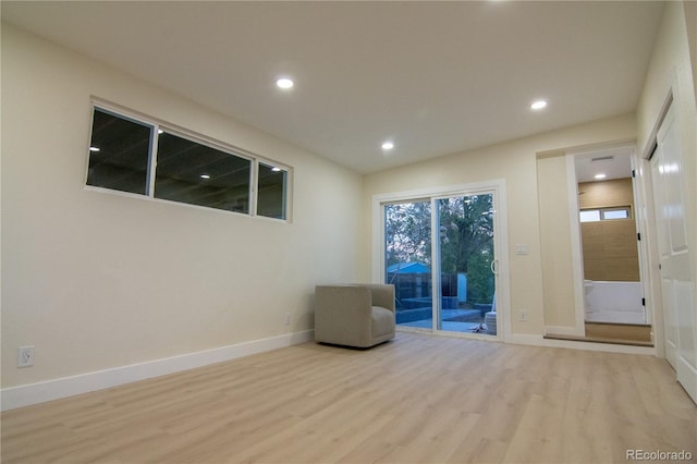 2441 W 55th Ave, Denver, CO 80221 - unfurnished room with wood finished floors, recessed lighting, and baseboards