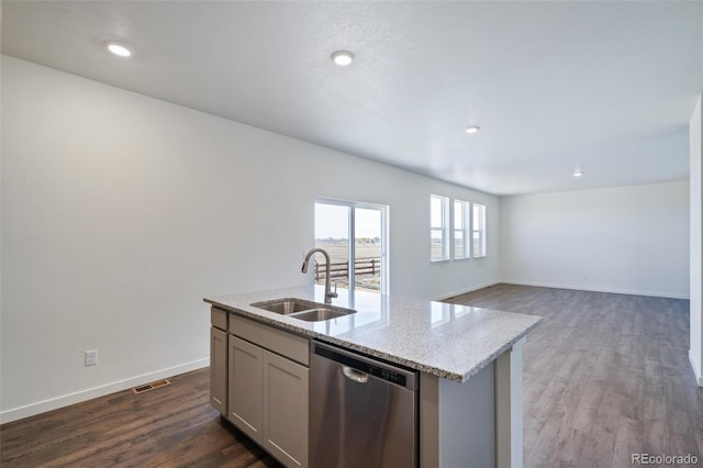 kitchen with visible vents, a sink, dark wood-style floors, light stone countertops, and dishwasher