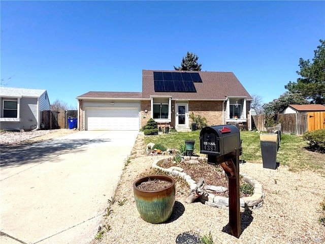 4383 S Eagle Cir, Aurora, CO 80015 - view of front of house featuring solar panels, a garage, brick siding, concrete driveway, and a shingled roof