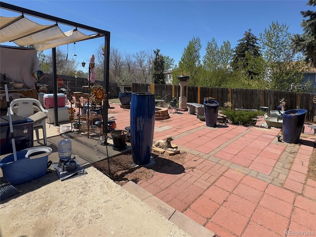 4383 S Eagle Cir, Aurora, CO 80015 - fenced backyard with an outdoor fire pit and a patio area