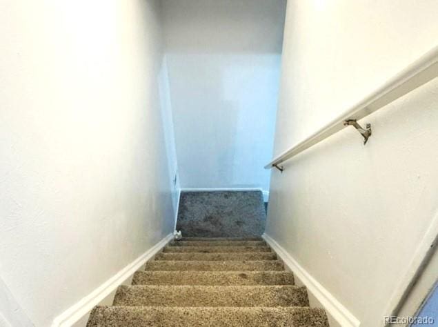 4383 S Eagle Cir, Aurora, CO 80015 - staircase featuring carpet floors and baseboards