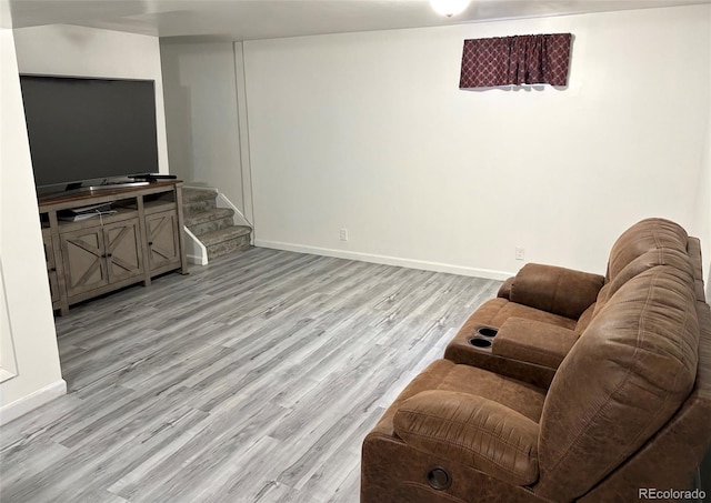 4383 S Eagle Cir, Aurora, CO 80015 - living room with light wood-style floors, baseboards, and stairway