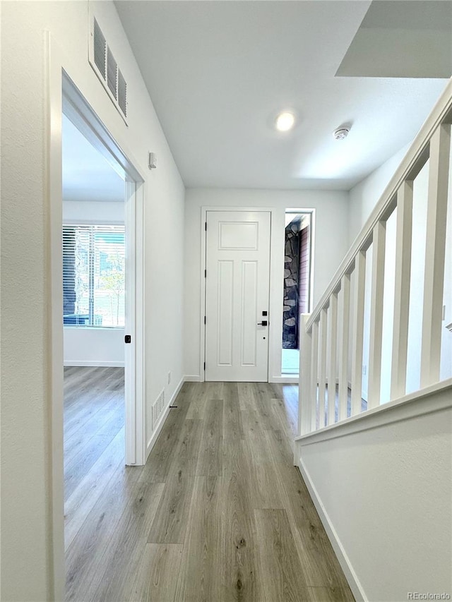 9662 Browns Peak Cir, Littleton, CO 80125 - foyer with stairway, wood finished floors, and baseboards