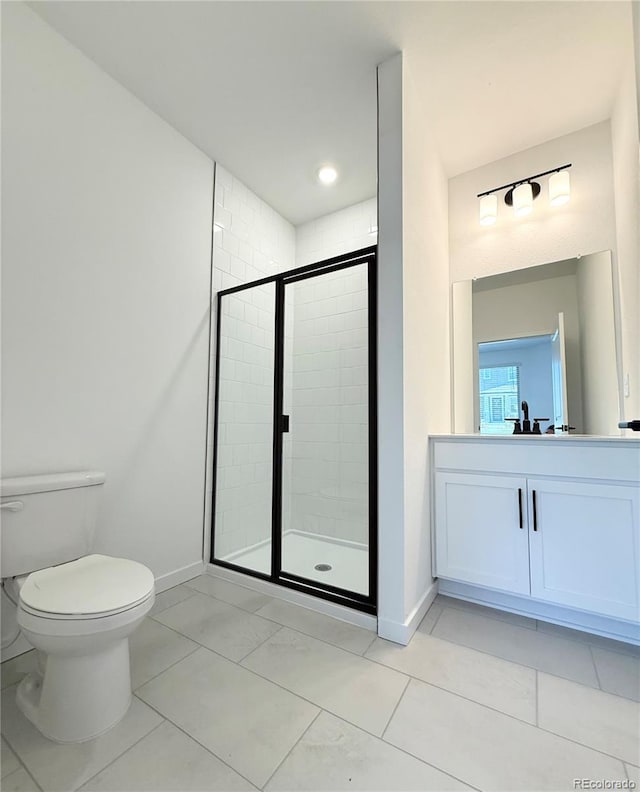 9662 Browns Peak Cir, Littleton, CO 80125 - bathroom featuring toilet, vanity, baseboards, and a stall shower