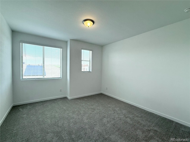 9662 Browns Peak Cir, Littleton, CO 80125 - unfurnished room with dark colored carpet and baseboards