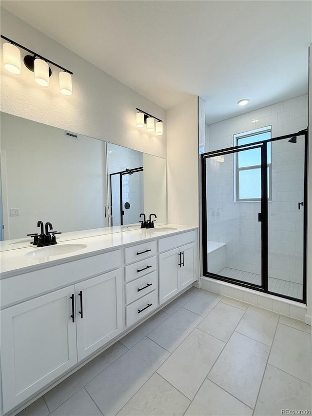 9662 Browns Peak Cir, Littleton, CO 80125 - bathroom featuring double vanity and a shower stall