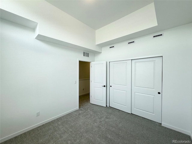9662 Browns Peak Cir, Littleton, CO 80125 - unfurnished bedroom with dark colored carpet, baseboards, and a closet