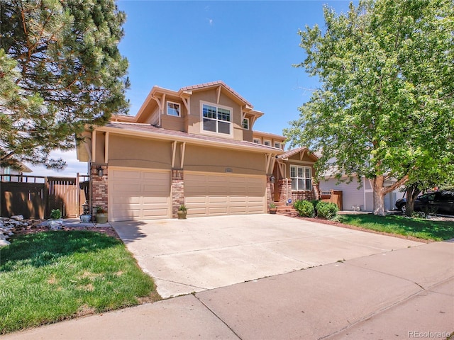 2485 Greensborough Cir, Highlands Ranch, CO 80129 - craftsman inspired home featuring stucco siding, a garage, concrete driveway, and stone siding