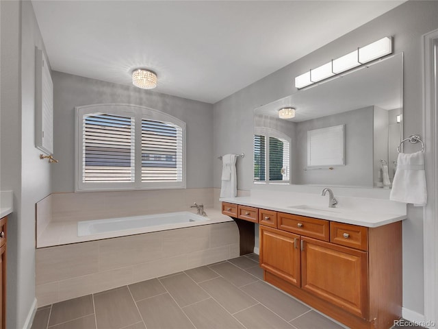 2485 Greensborough Cir, Highlands Ranch, CO 80129 - full bath featuring vanity, a garden tub, and tile patterned flooring