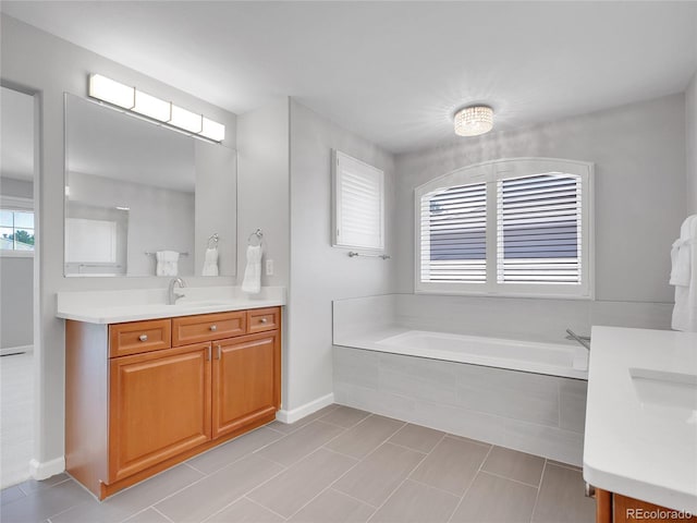 2485 Greensborough Cir, Highlands Ranch, CO 80129 - full bathroom with vanity, a bath, and tile patterned flooring