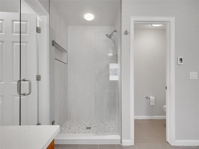 2485 Greensborough Cir, Highlands Ranch, CO 80129 - bathroom featuring a stall shower, tile patterned floors, and vanity