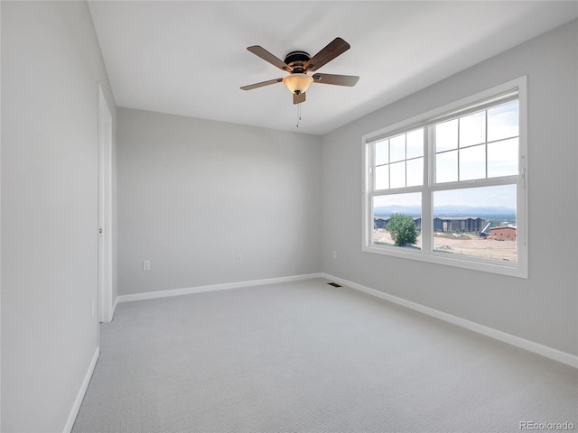 2485 Greensborough Cir, Highlands Ranch, CO 80129 - empty room featuring light colored carpet and ceiling fan