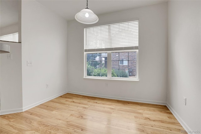 empty room with light hardwood / wood-style floors