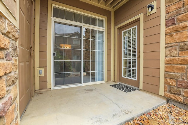 property entrance with a patio