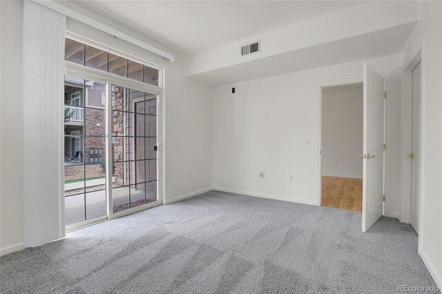 spare room featuring carpet floors