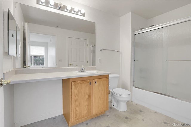 full bathroom with toilet, bath / shower combo with glass door, and vanity